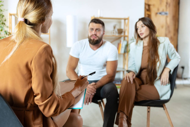 Session with family psychologist. Married couple, unhappy man and woman meeting with consultant to solve problem - Φωτογραφία, εικόνα