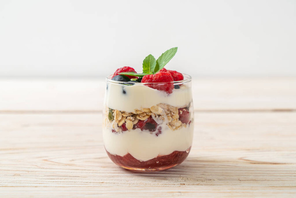 homemade raspberry and blueberry with yogurt and granola - healthy food style - Φωτογραφία, εικόνα