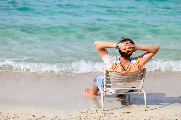 Man relaxing at beach - Photo, Image