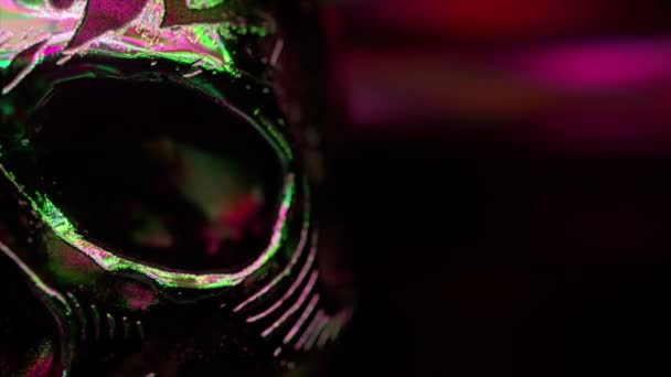 Human skull with gold accents close-up. Horror and halloween fear concept. Neon light. 3d animation - Footage, Video