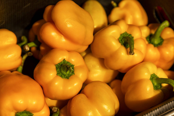 Large yellow bell peppers in the store. Vitamins and health from nature. Close-up. Selective focus. - Valokuva, kuva