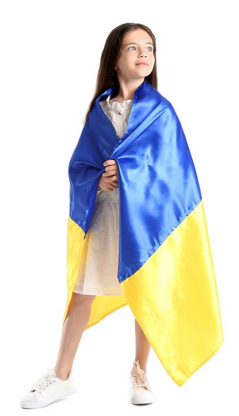 Little girl with Ukrainian flag on white background - Valokuva, kuva