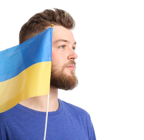Fiatal férfi ukrán zászló fehér háttér - Fotó, kép