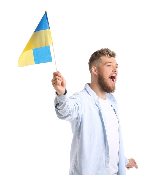 Screaming young man with Ukrainian flag on white background - Photo, Image