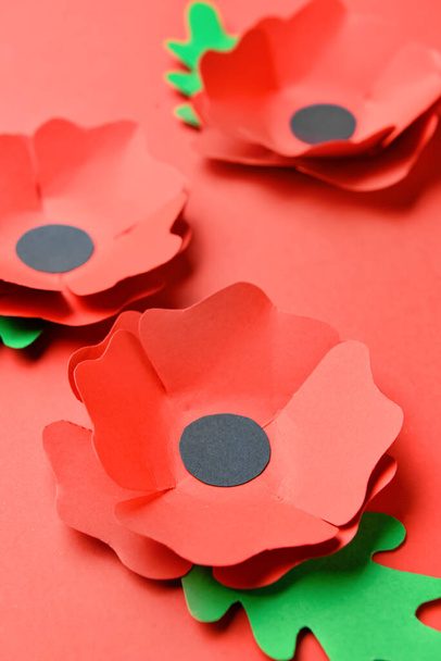 Remembrance Day in Canada. Red poppy flowers on red background - Photo, Image