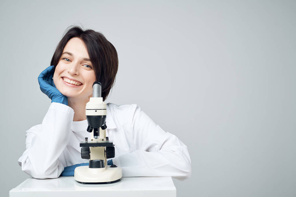 woman scientist laboratory microscope biotechnology research - Photo, Image