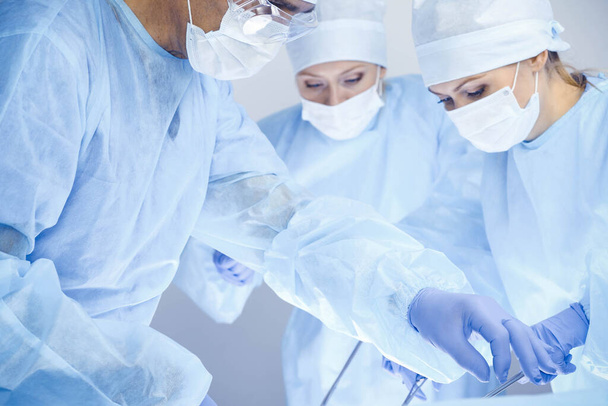 A group of surgeons is operating at the hospital. Health care concept - Foto, Bild