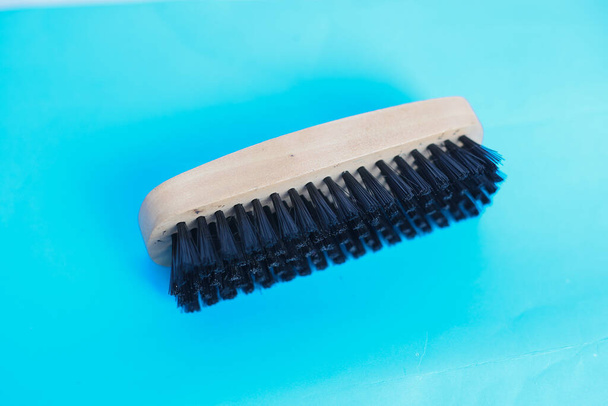 Manual Wood brush for cleaning with Blue background - 写真・画像