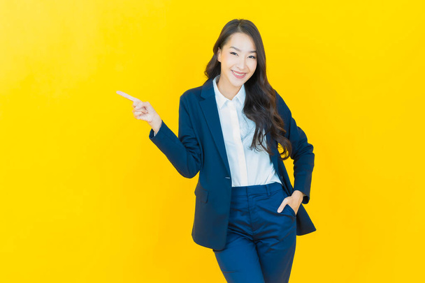 Portrait beautiful young asian woman smile with action on color background - Zdjęcie, obraz
