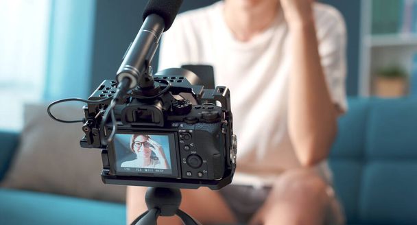 Professional vlogger and youtuber shooting a video at home - Fotoğraf, Görsel
