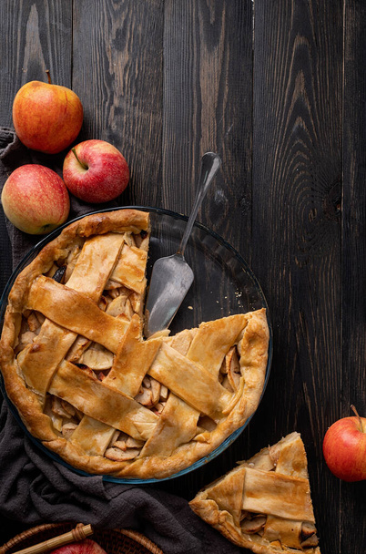 Top view of homemade apple pie on black wooden table - 写真・画像