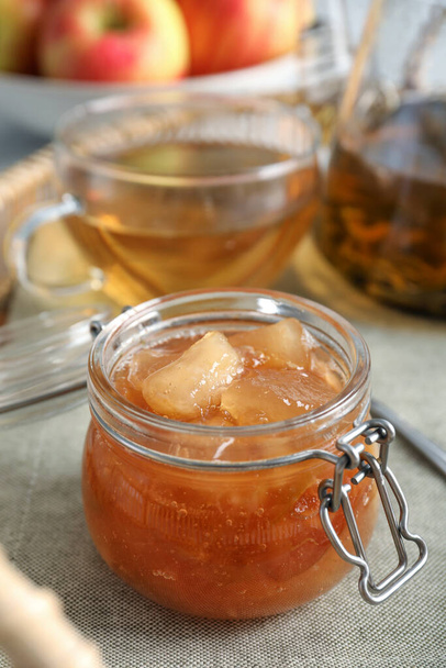 Delicious apple jam in jar on table, closeup - Photo, image