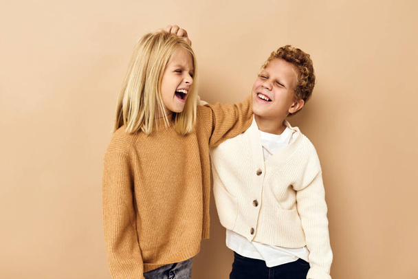 children together fashion clothes posing emotions - 写真・画像