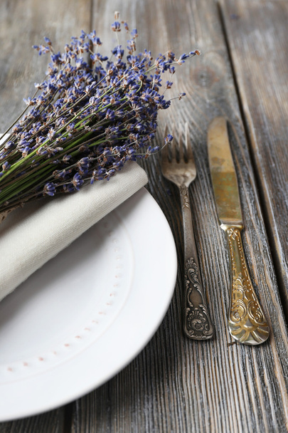 Dining table setting with lavender flowers on wooden table background - Photo, Image