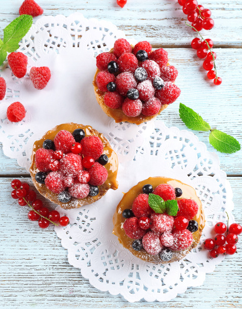 Sweet cakes with berries on table close-up - Φωτογραφία, εικόνα