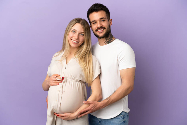 Young couple pregnant and happy - Фото, изображение