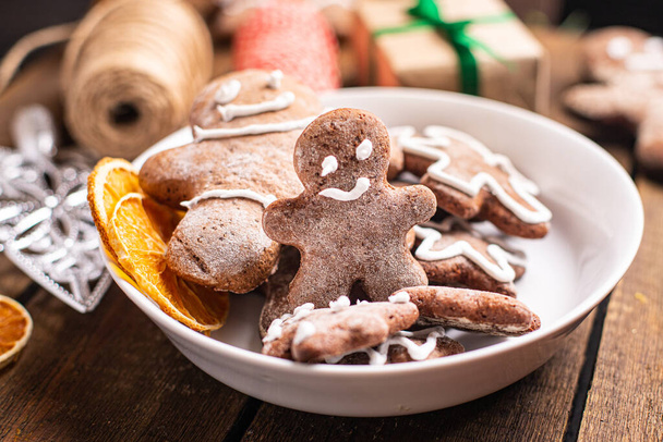 gingerbread cookie christmas new year treat sweet dessert gingerbread man ginge meal snack on the table copy space food background rustic - 写真・画像