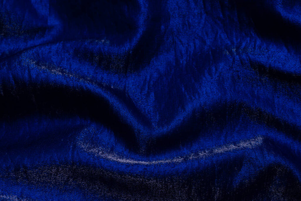Purple shiny fabric as a background. Top view. - Photo, Image