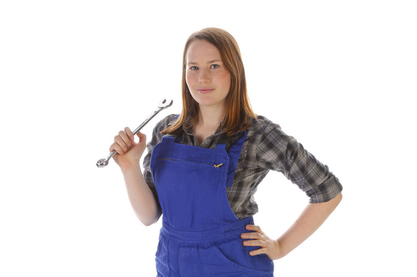 Cute young crafts woman with spanner - Foto, afbeelding