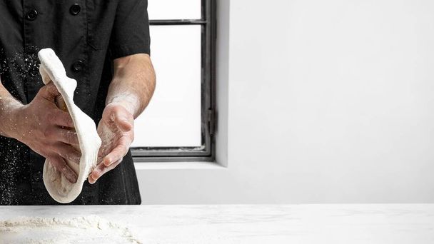 pizza chef making pizza dough with copy space. High quality beautiful photo concept - Foto, immagini