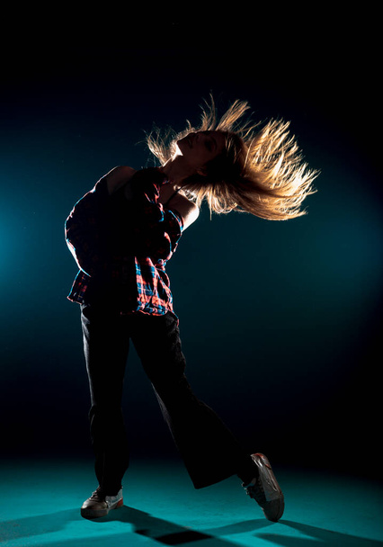 Stylish young girl performing an artistic dance choreography - Photo, Image