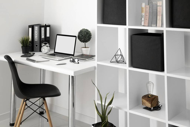 office desk with laptop chair shelf. High quality beautiful photo concept - Photo, Image