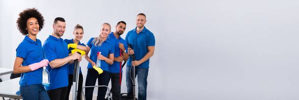 Commercial Janitor Cleaning Service. Diverse Group In Office - Foto, afbeelding