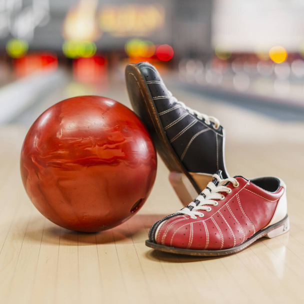 red bowling ball bowling shoes. High quality beautiful photo concept - Photo, Image