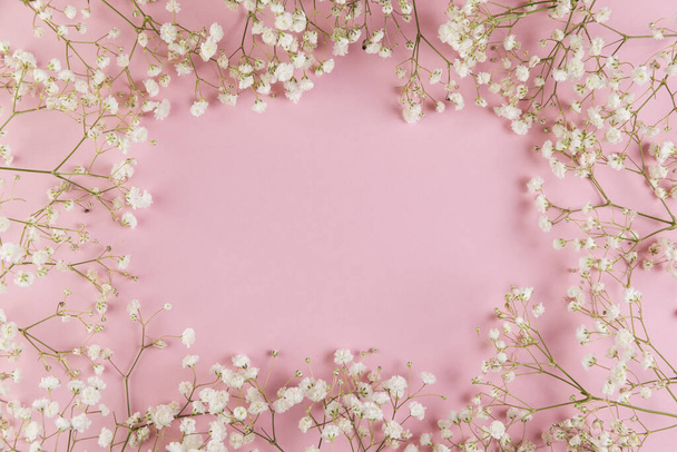 blank space writing text with fresh white gypsophila flower against pink background. High quality beautiful photo concept - Zdjęcie, obraz