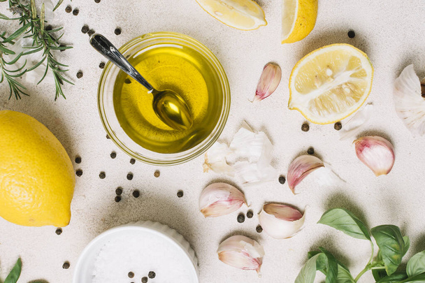 close up shot top view olive oil surrounded by cooking ingredients. High quality beautiful photo concept - Foto, Bild