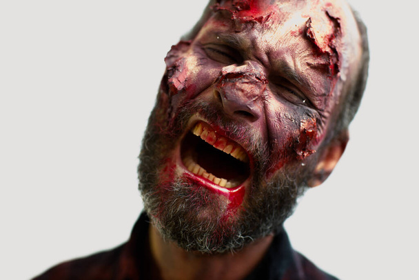 Zombie male makeup for halloween concept. Blood on skin face - Photo, Image