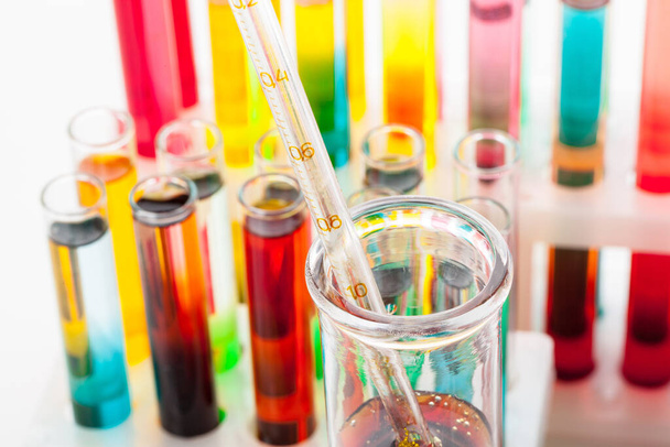 Test tubes with colorful chemicals close up in laboratory - Foto, Bild