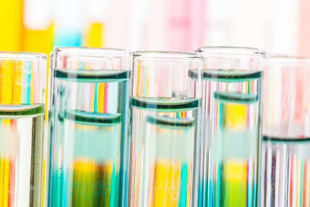 Still life in laboratory. Test tubes with colorful chemicals - Foto, Imagen