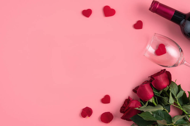 Valentine's Day dating gift with wine and rose concept on pink background design concept - Fotoğraf, Görsel