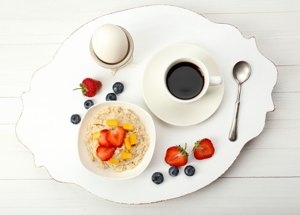 Delicious breakfast with coffee, egg and oatmeal - Foto, Imagen