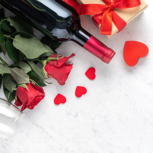 Top view of Valentine day gift with rose and wine, festive design concept for special holiday dating meal. - Fotografie, Obrázek