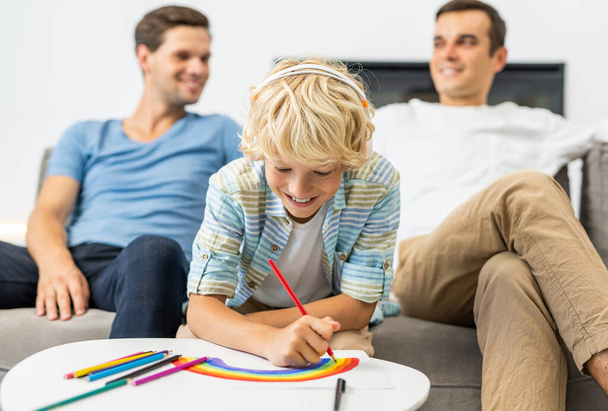 Lgbt family, gay couple with adopted son - Homosexual parents with their kid having fun at home - Fotó, kép