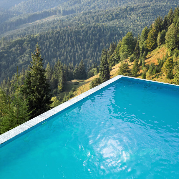 Outdoor swimming pool at luxury resort and beautiful view of mountains on sunny day - Photo, Image