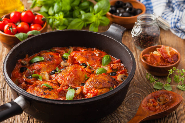 Traditionally made chicken in tomato sauce cacciatore. Front view.  - Φωτογραφία, εικόνα