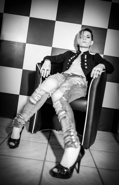 beautiful alternative girl with on the modern armchair . High quality photo - Fotoğraf, Görsel