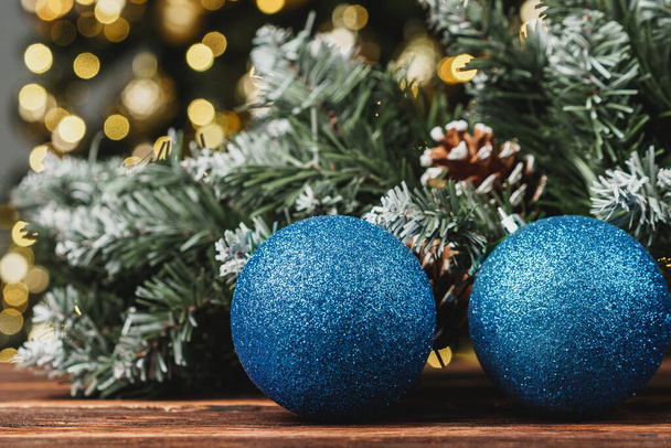 Christmas decorative balls against blurred pine tree background - Fotoğraf, Görsel
