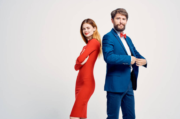 a man in a suit next to a woman in a red dress romance happy isolated background - Photo, Image