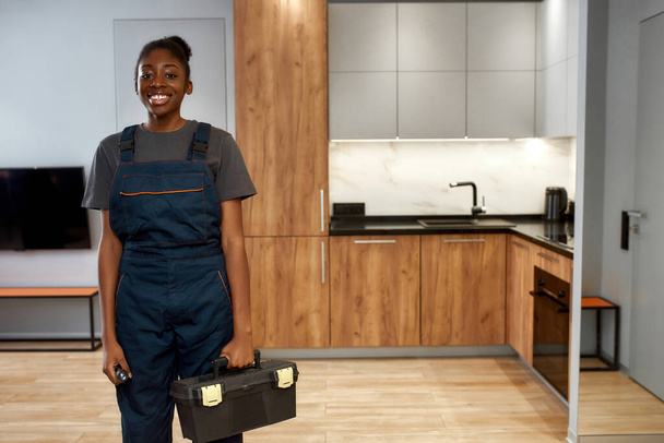 Portrait of young african american woman, professional technician - 写真・画像
