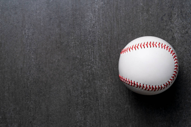 baseball on black table background, top view sport concept - Foto, afbeelding
