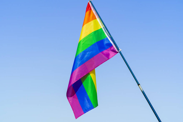 LGBT waving flag in the sky on flagpole - Photo, Image