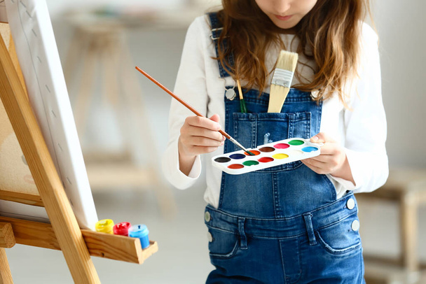 Cute little girl painting at home - Photo, Image