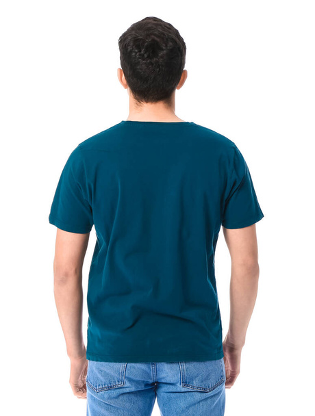 Handsome young man in stylish t-shirt on white background, back view - Foto, Imagen