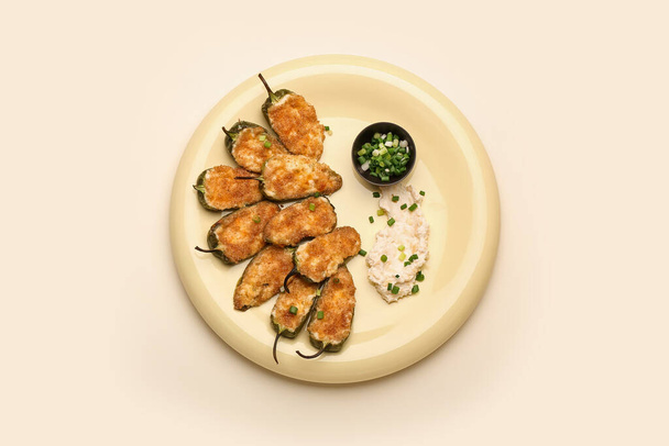Plate with delicious jalapeno poppers on light background - Photo, Image