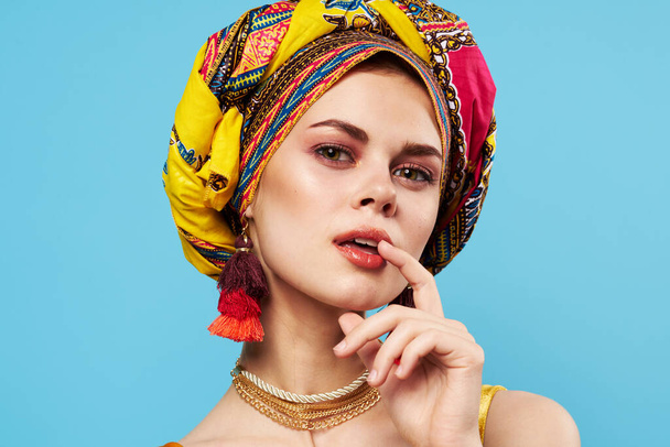 beautiful woman in multicolored turban attractive look Jewelry smile isolated background - Photo, image