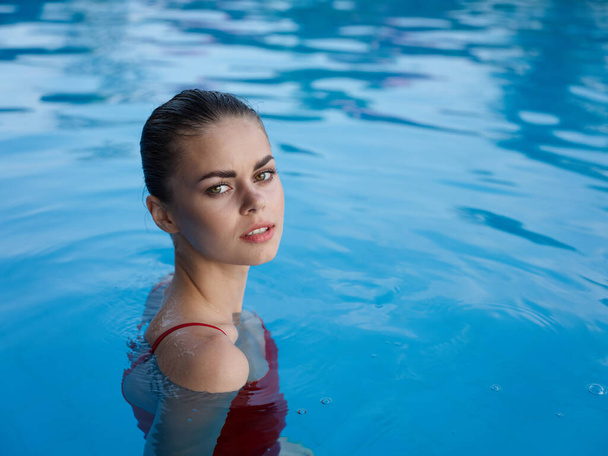 attractive woman in the pool swimwear close-up luxury - Fotografie, Obrázek